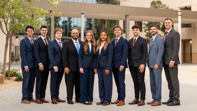 Management Residency students taking a photo on campus