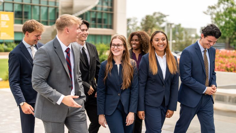 Management Residency Summer Business Internship students dressed in suits